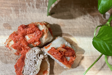 cabbage rolls on a wooden cutting board