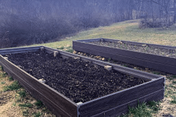 two raised beds in a field